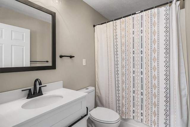 full bathroom with toilet, a shower with shower curtain, a textured ceiling, and vanity