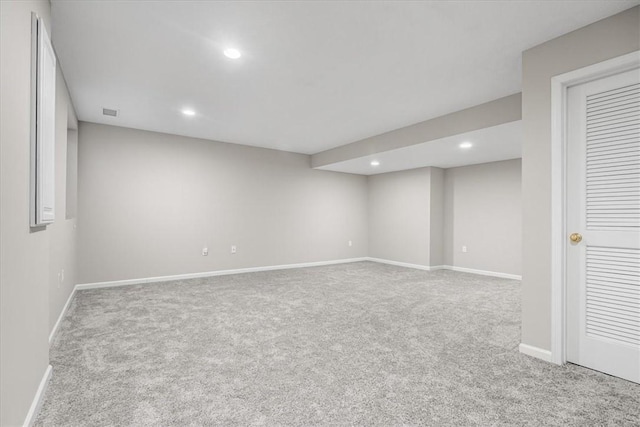 unfurnished room featuring carpet, baseboards, and recessed lighting