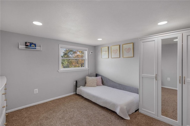 carpeted bedroom with recessed lighting and baseboards