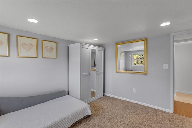 carpeted bedroom with recessed lighting and baseboards