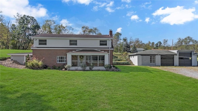 back of house featuring an attached garage, a sunroom, a lawn, a chimney, and gravel driveway