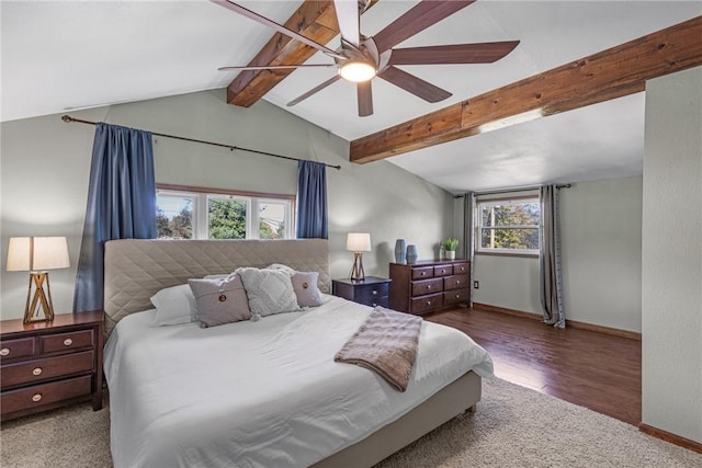 bedroom with vaulted ceiling with beams, wood finished floors, a ceiling fan, and baseboards