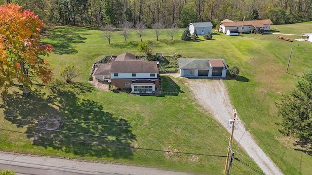 birds eye view of property with a rural view