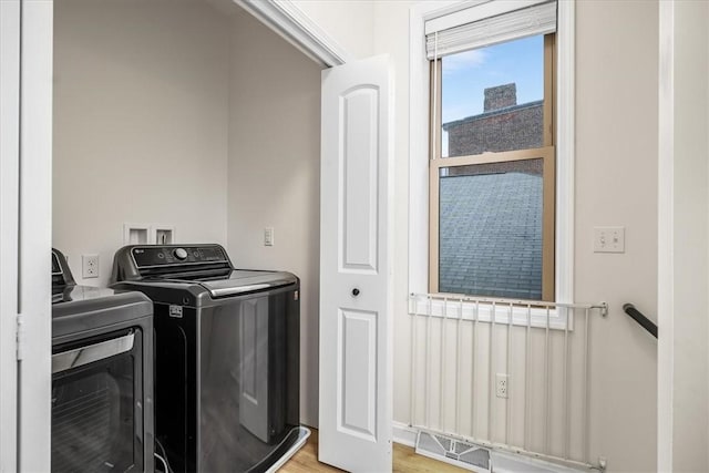 laundry area featuring washer and dryer, laundry area, and visible vents