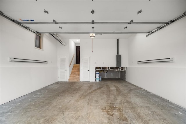 parking garage with electric panel and a garage door opener