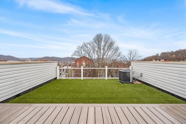 view of yard featuring cooling unit and fence