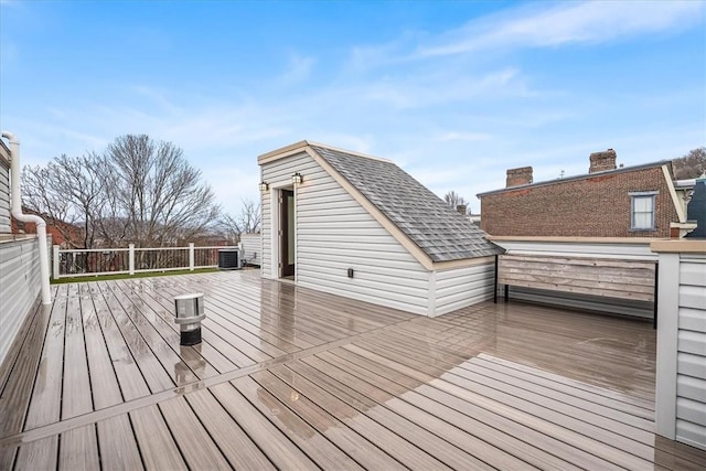 wooden terrace featuring central air condition unit