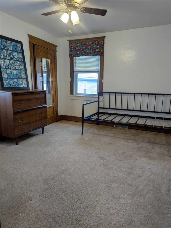 bedroom with carpet floors and baseboards