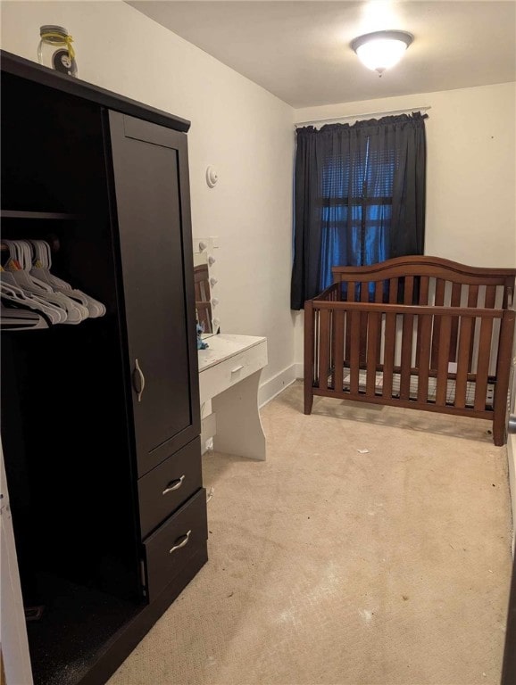 bedroom with light colored carpet