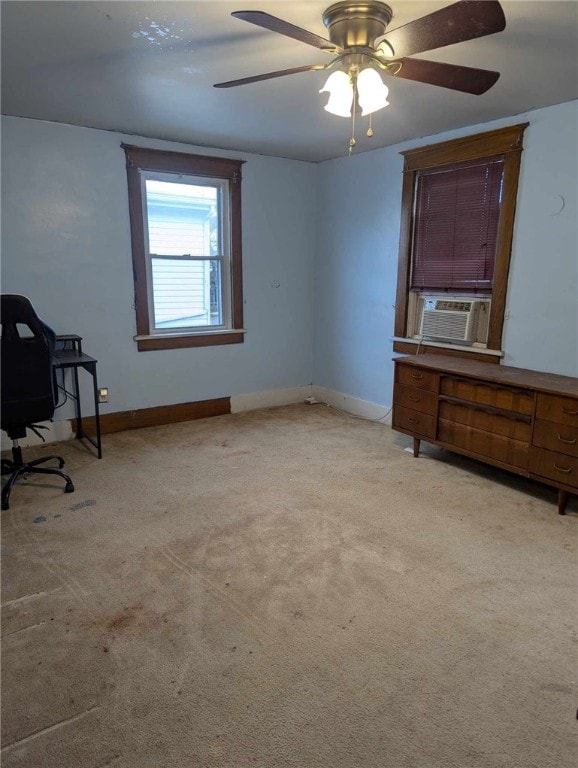 office area with baseboards, cooling unit, and light colored carpet