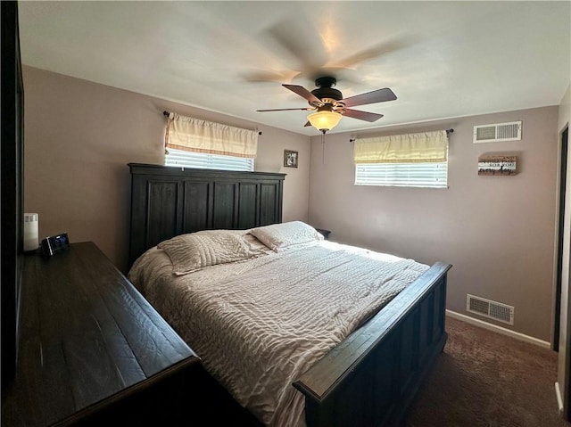 bedroom with multiple windows, carpet flooring, and visible vents