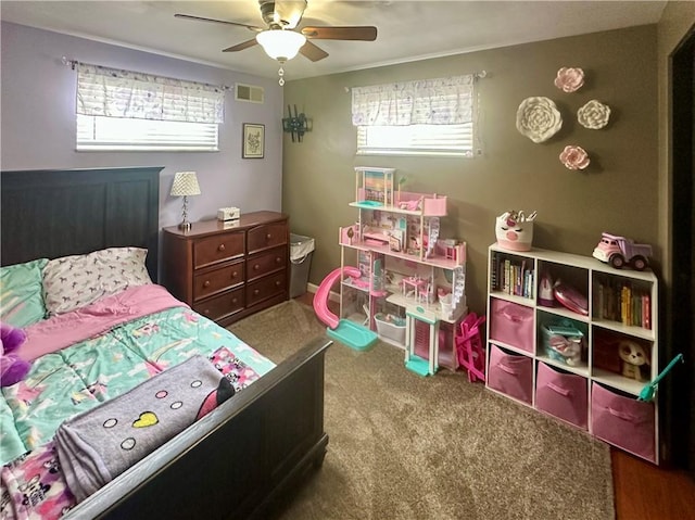 bedroom featuring ceiling fan, visible vents, and carpet flooring