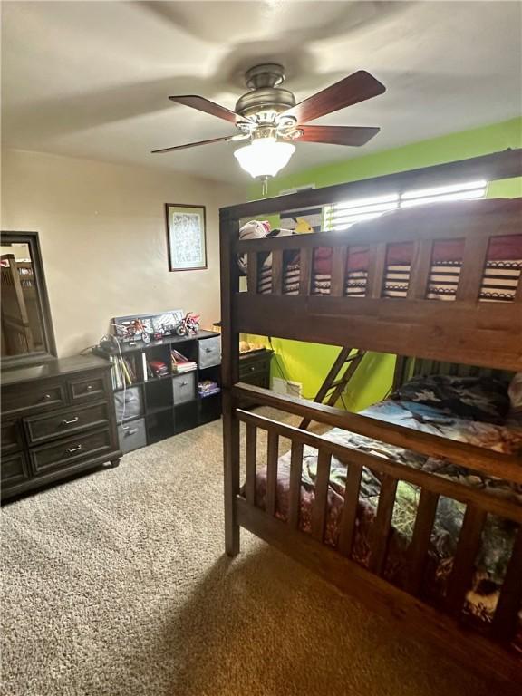 carpeted bedroom with ceiling fan