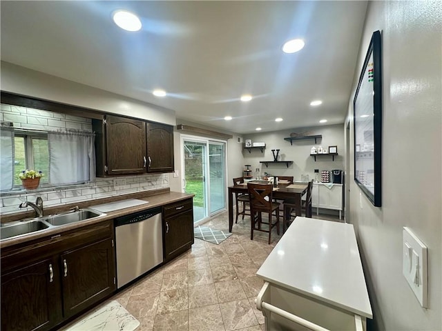 kitchen with recessed lighting, decorative backsplash, stainless steel dishwasher, dark brown cabinetry, and a sink