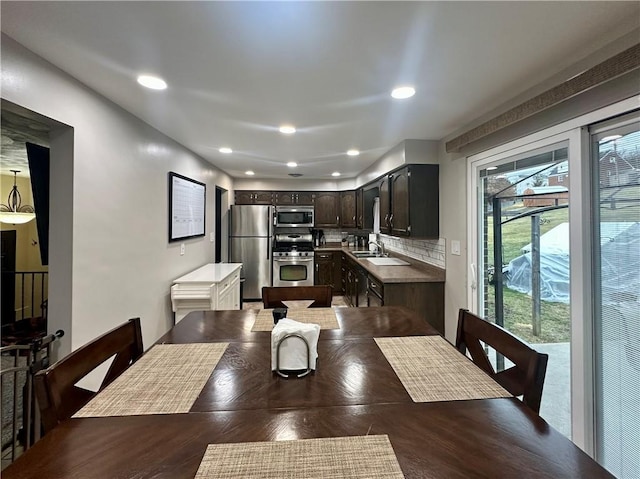 dining room featuring recessed lighting