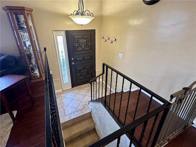 tiled foyer with baseboards