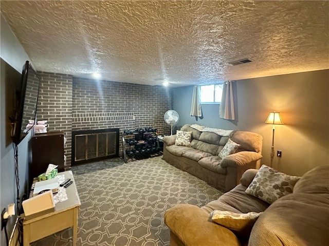 carpeted living area with visible vents, a fireplace, and a textured ceiling