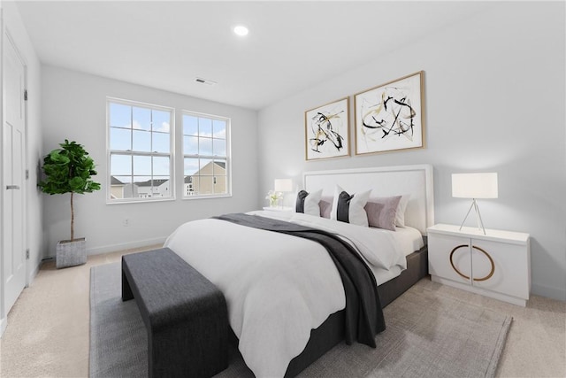 bedroom with baseboards, visible vents, and carpet flooring