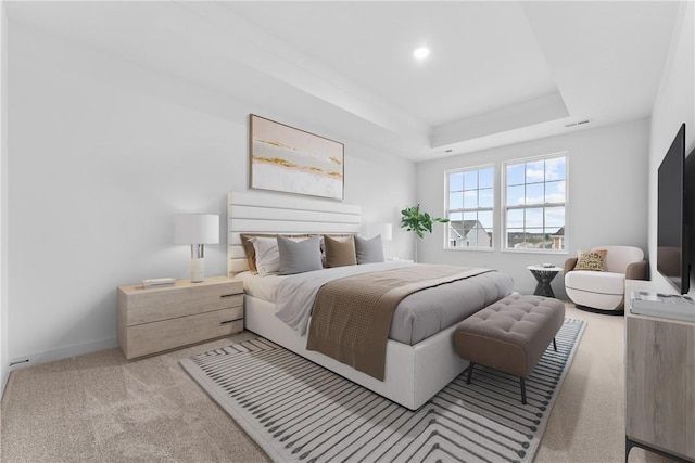 bedroom featuring baseboards, visible vents, a tray ceiling, carpet floors, and recessed lighting