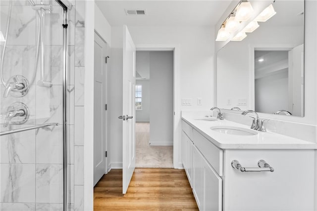 full bathroom with a shower stall, visible vents, and a sink