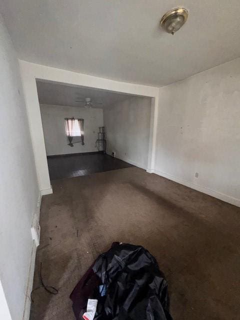 living room with carpet and baseboards