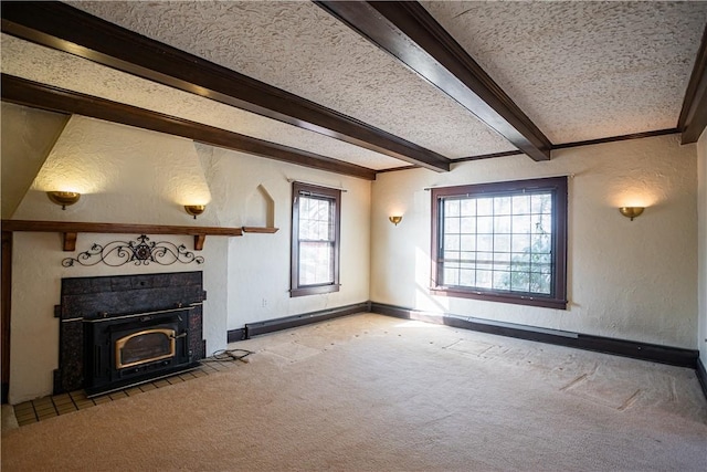 unfurnished living room with a fireplace, a textured wall, light carpet, a textured ceiling, and beamed ceiling