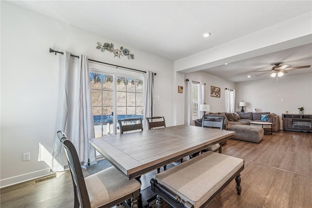 dining area featuring recessed lighting, wood finished floors, visible vents, and a healthy amount of sunlight