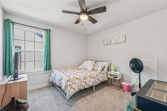 bedroom with carpet floors, ceiling fan, and baseboards