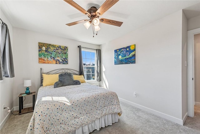 carpeted bedroom featuring ceiling fan and baseboards