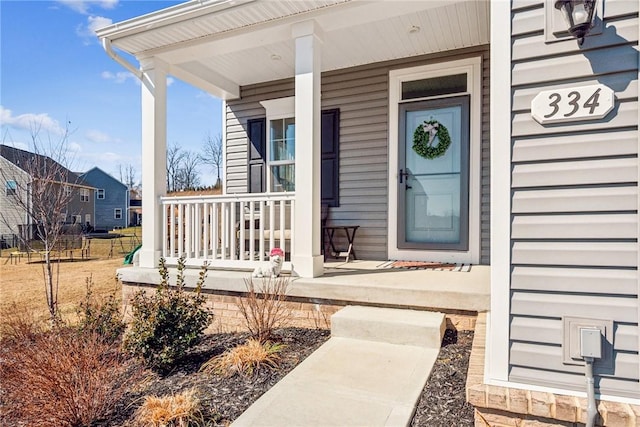 doorway to property featuring a porch