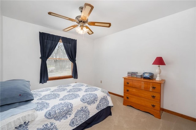 bedroom with carpet floors, ceiling fan, and baseboards