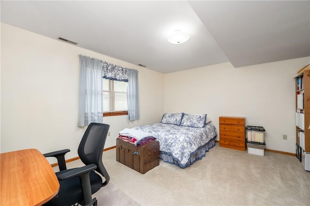 carpeted bedroom with baseboards and visible vents