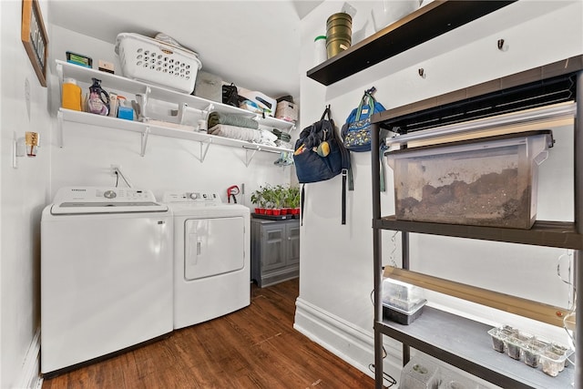 clothes washing area with laundry area, independent washer and dryer, and wood finished floors