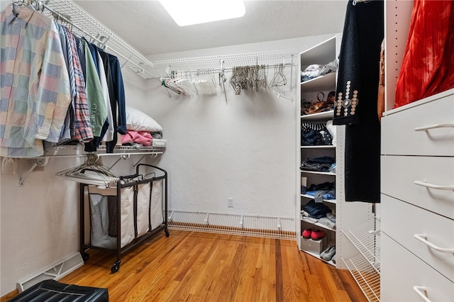 spacious closet featuring wood finished floors