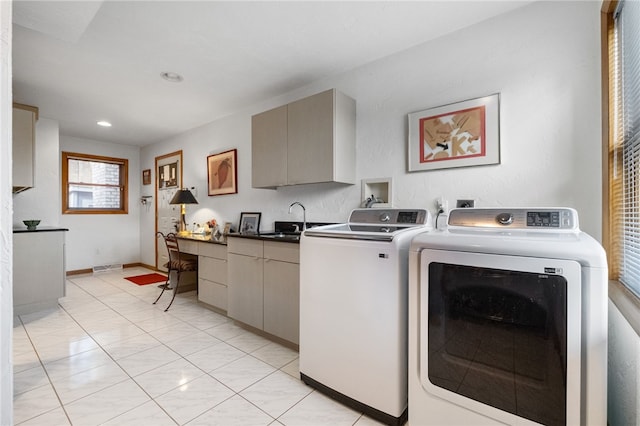 laundry room featuring recessed lighting, a sink, visible vents, washer and dryer, and cabinet space