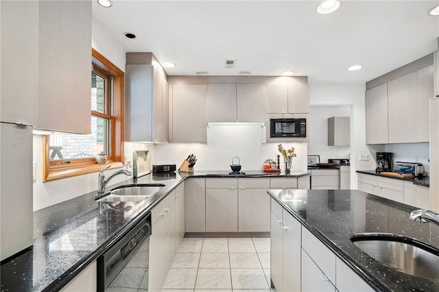 kitchen with black appliances, dark stone countertops, a sink, and recessed lighting