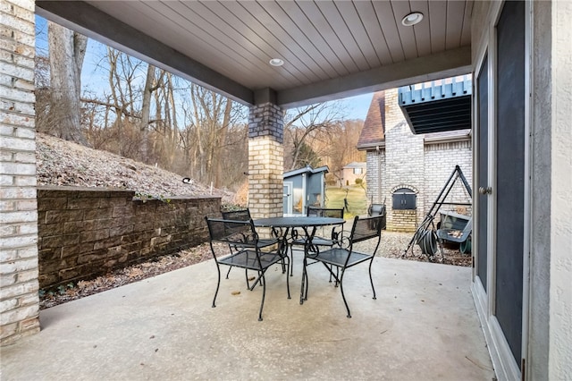 view of patio featuring outdoor dining area