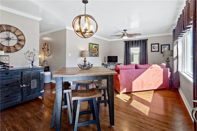 dining area with ceiling fan with notable chandelier, crown molding, baseboards, and wood finished floors