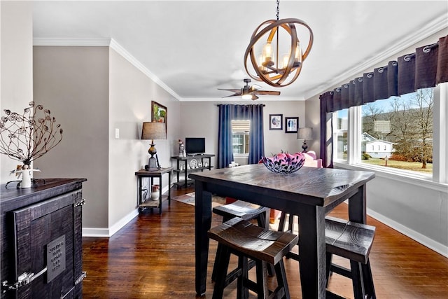 dining area with baseboards, ceiling fan with notable chandelier, wood finished floors, and crown molding