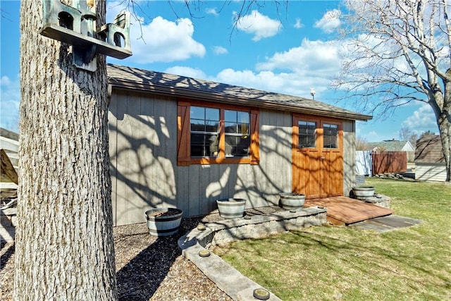 view of side of home featuring a yard