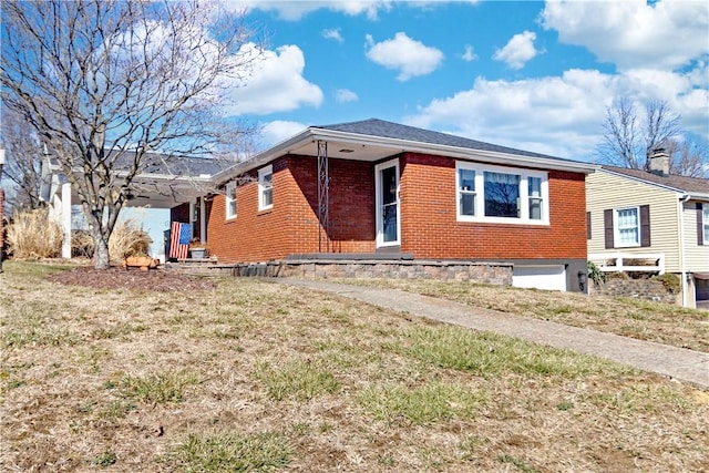 view of front of house featuring brick siding