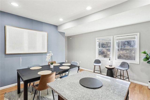 dining room with baseboards, recessed lighting, and light wood-style floors