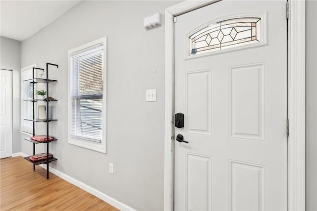 interior space with light wood-style floors and baseboards