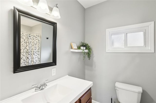 full bath featuring toilet and vanity