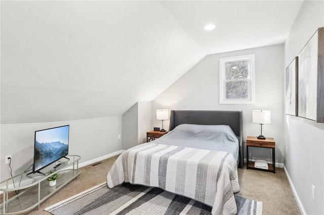 bedroom with carpet, visible vents, lofted ceiling, and baseboards