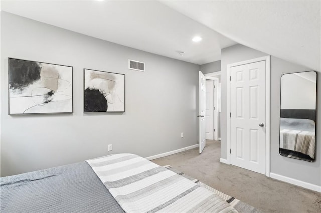 carpeted bedroom featuring vaulted ceiling, recessed lighting, visible vents, and baseboards