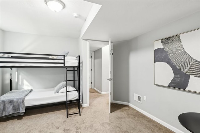 bedroom featuring carpet, visible vents, and baseboards