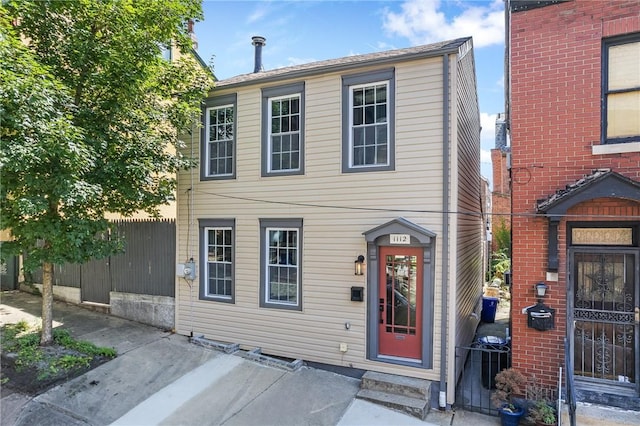 view of front of house with fence