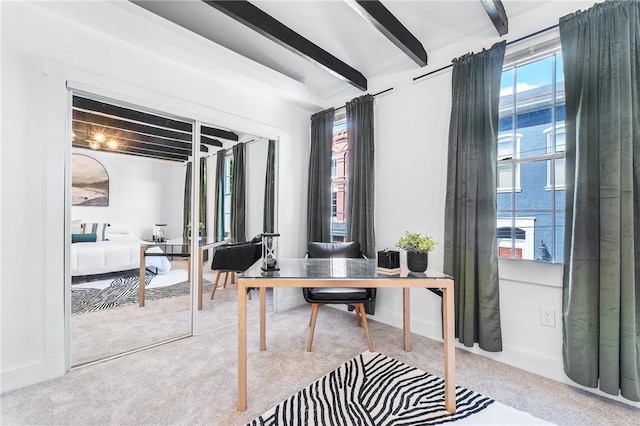 office featuring beamed ceiling and carpet flooring