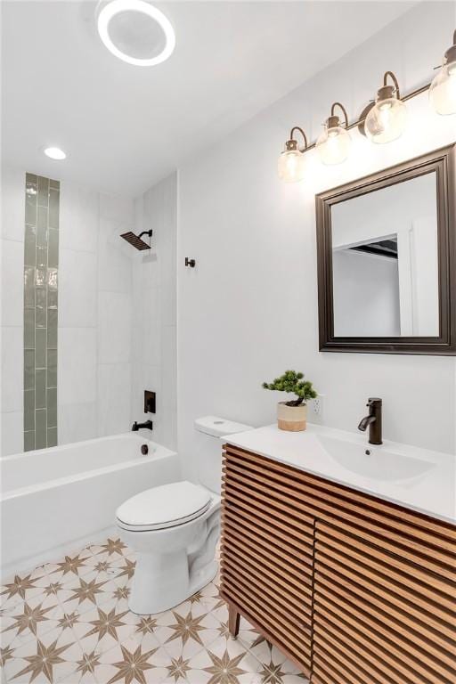 bathroom featuring  shower combination, vanity, toilet, and tile patterned floors